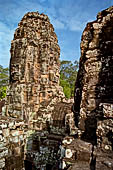 Angkor Thom - Bayon temple, second enclosure, corner towers seen from the central terrace 